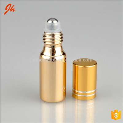 Hot products 5ml 10ml glass roll on bottle shiny UV coating perfume roll on bottle with golden aluminum cap and metal ball